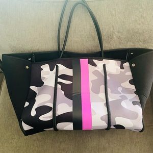 Haute Shore neoprene tote with wristlet. Magnetic closure, expandable sides.